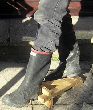 A wooden Eiffel tower, 'peace' boot remover
