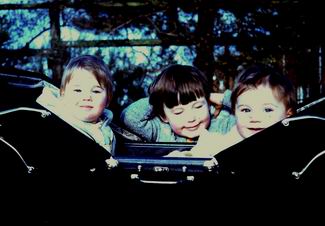 Jane, Jo and Elizabeth in the old pram in Avebury garden 1975 