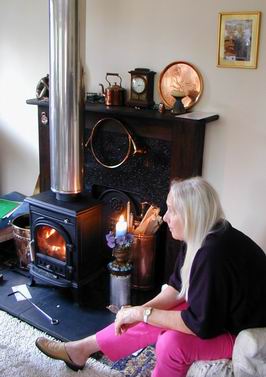 Mo sitting by the stove