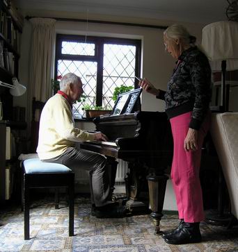 Colin reading an ipad and Mo a smart phone