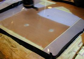 Pennies being scanned with the their image appearing above them